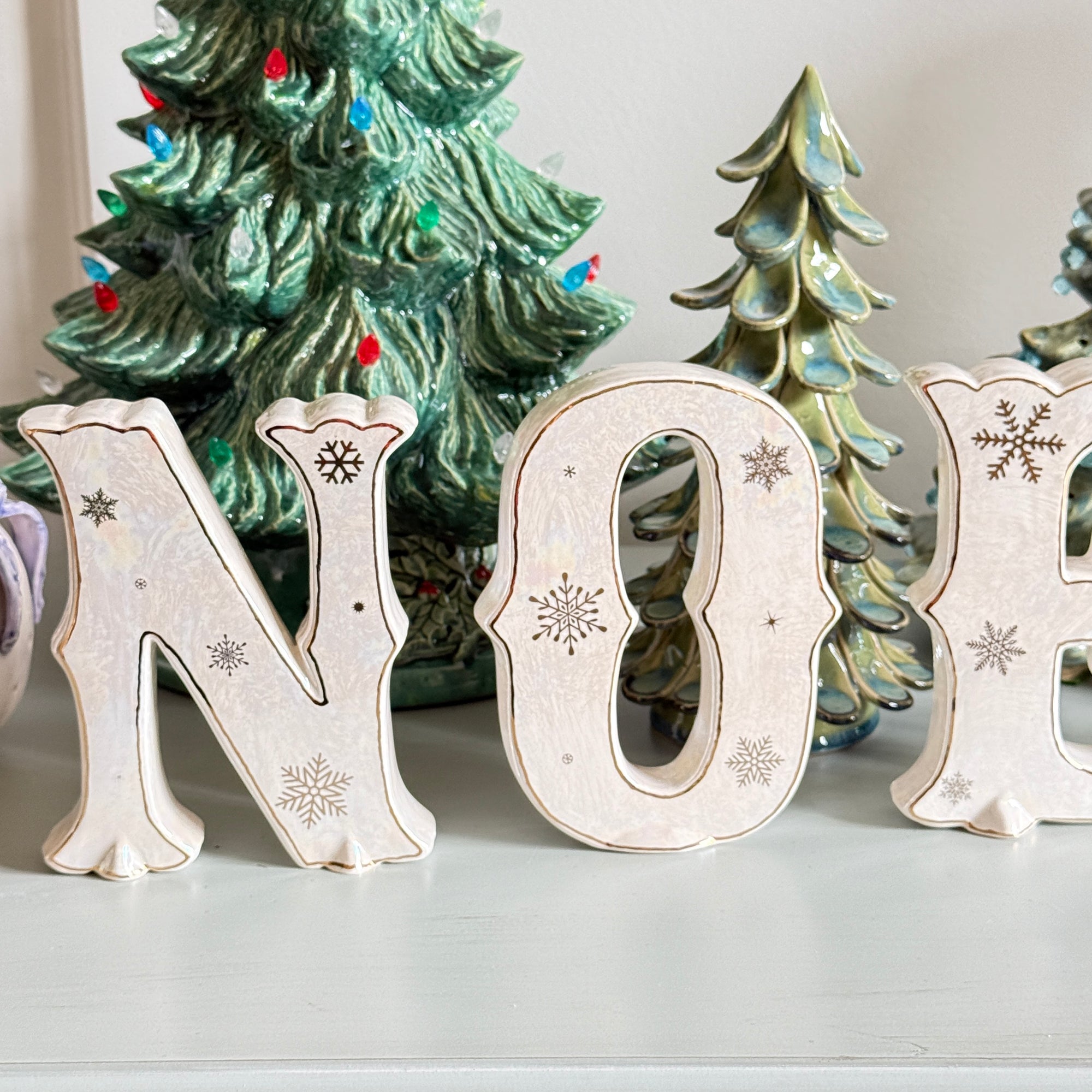 ‘NOEL’ – Iridescent White Ceramic Letter Set with Gold Accents